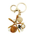 Porte clés "etoile des mers "métal doré, strass et perles